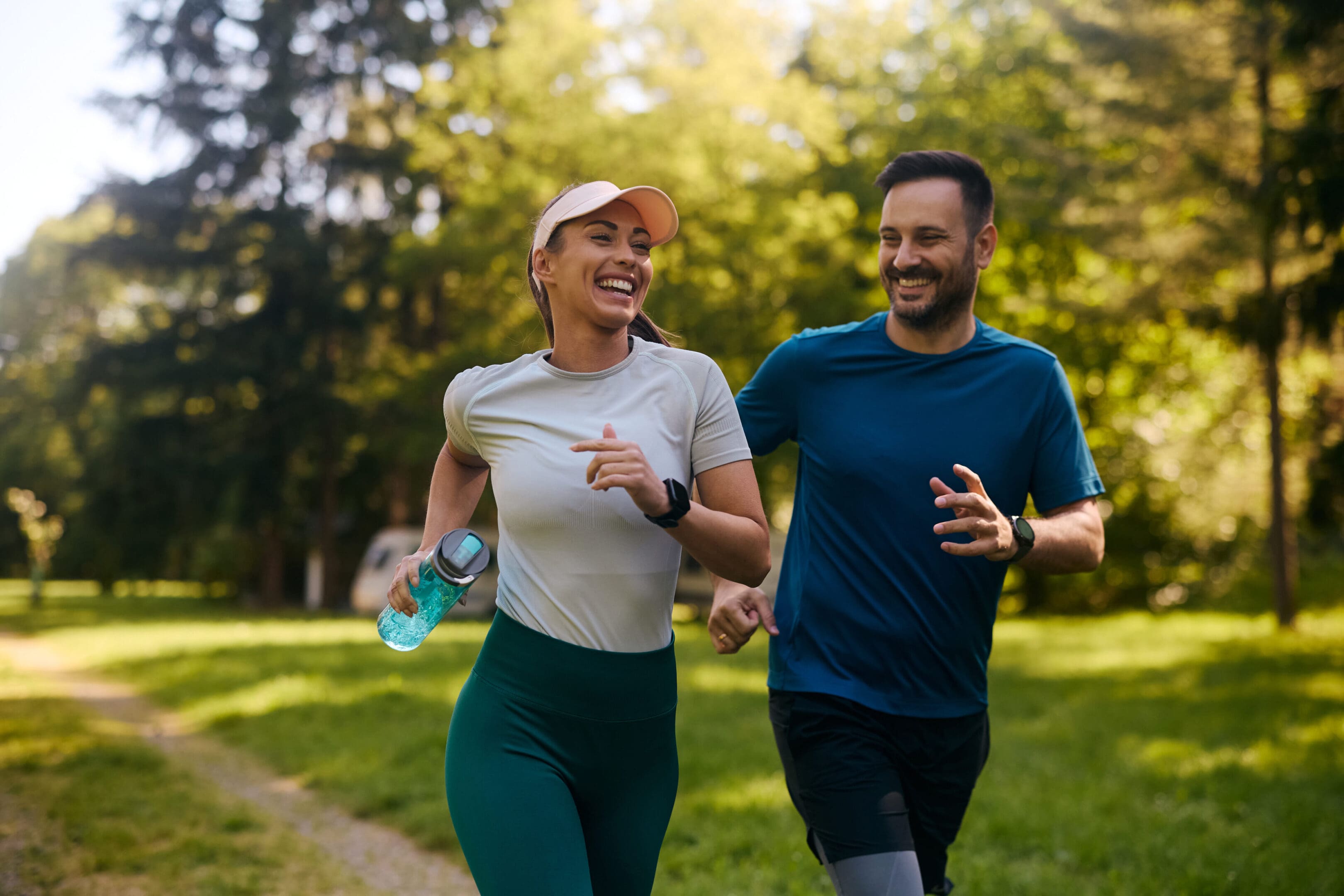 A man and woman running in the park